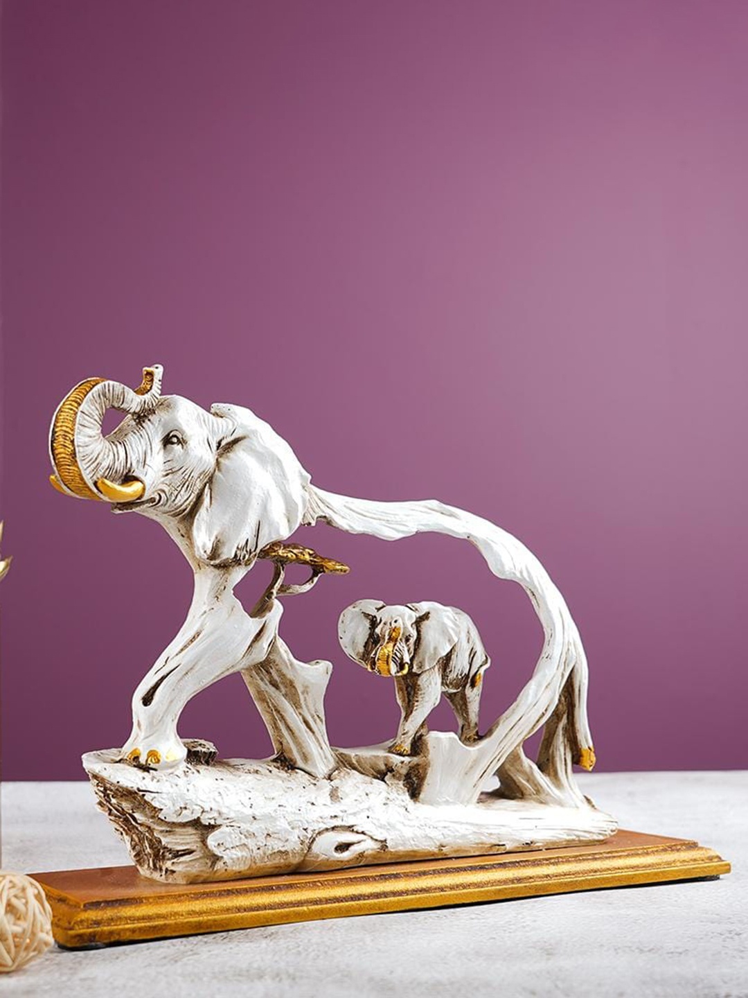 

THE ARTMENT White & Gold-Toned Elephant Fengshui Showpiece With Wooden Base