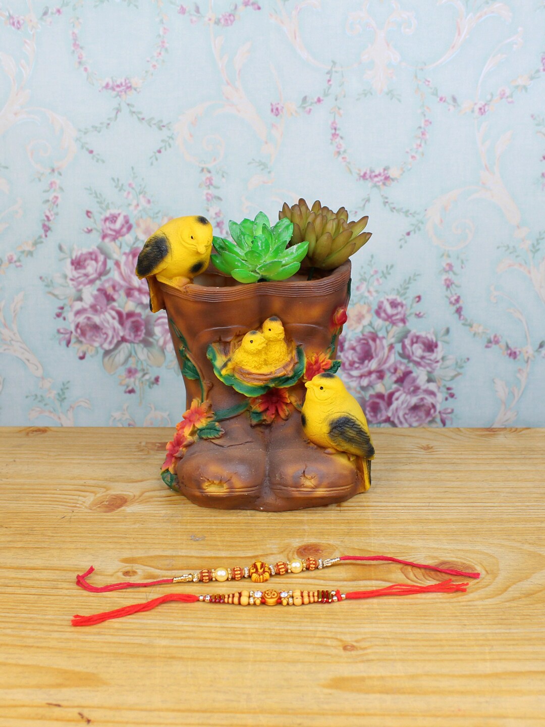 

Wonderland Brown & Red Set Of 2 Rakhi With Birds on Shoe Succulent Planter