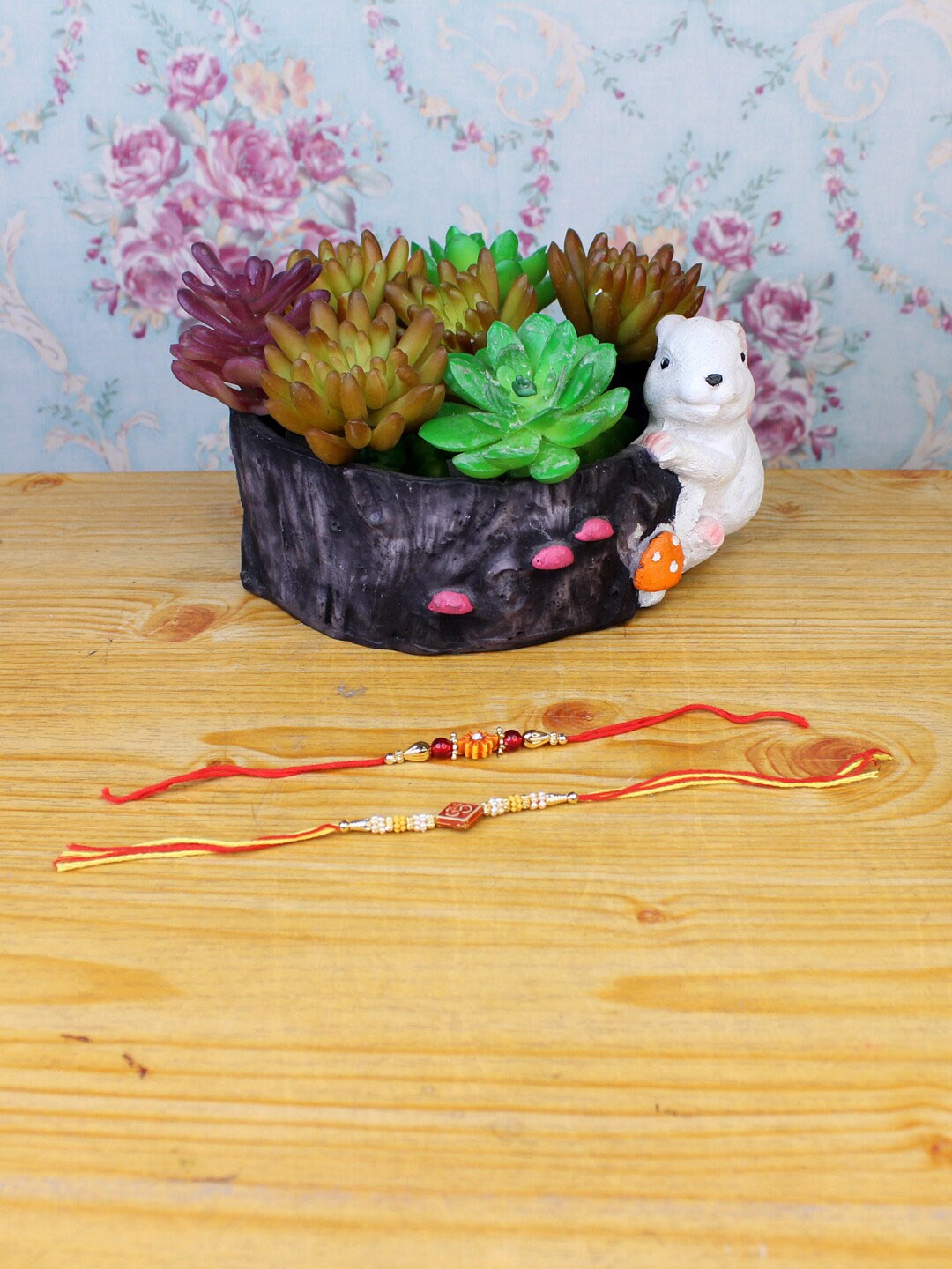 

Wonderland Black & Red Set Of 2 Rakhi With Rabbit Succulent Planter