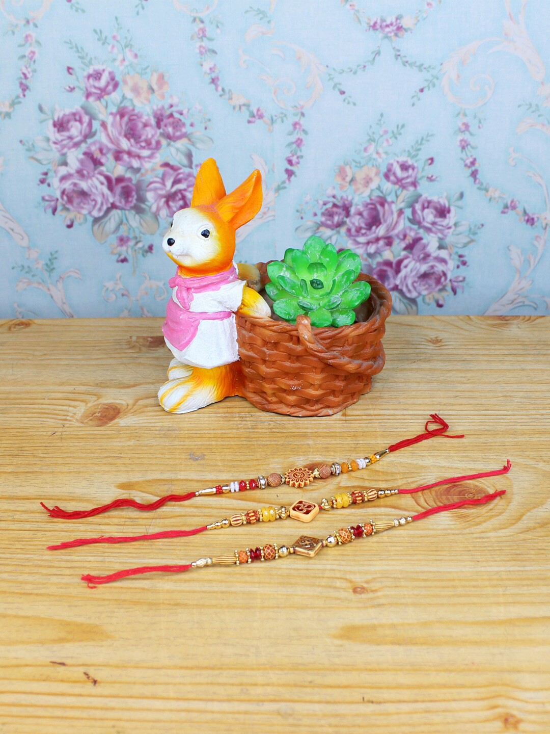 

Wonderland Brown & Red Set Of 3 Rakhi With Bunny with Basket Succulent Planter