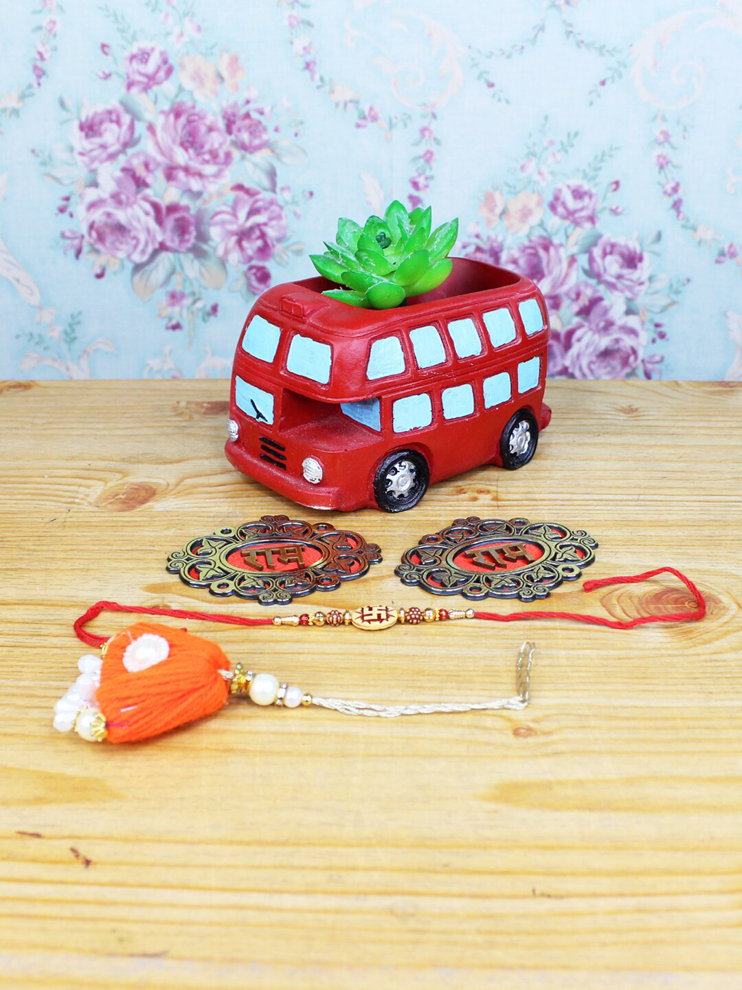 

Wonderland Red Set Of 2 Rakhi With Bus Succulent Planter