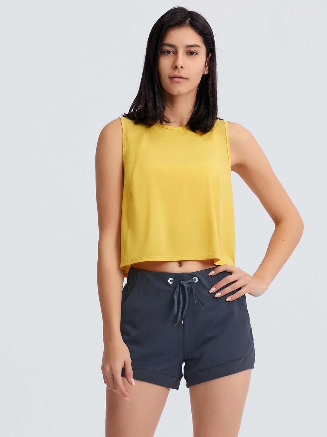 

URBANIC Yellow Solid Cut Out Regular Top