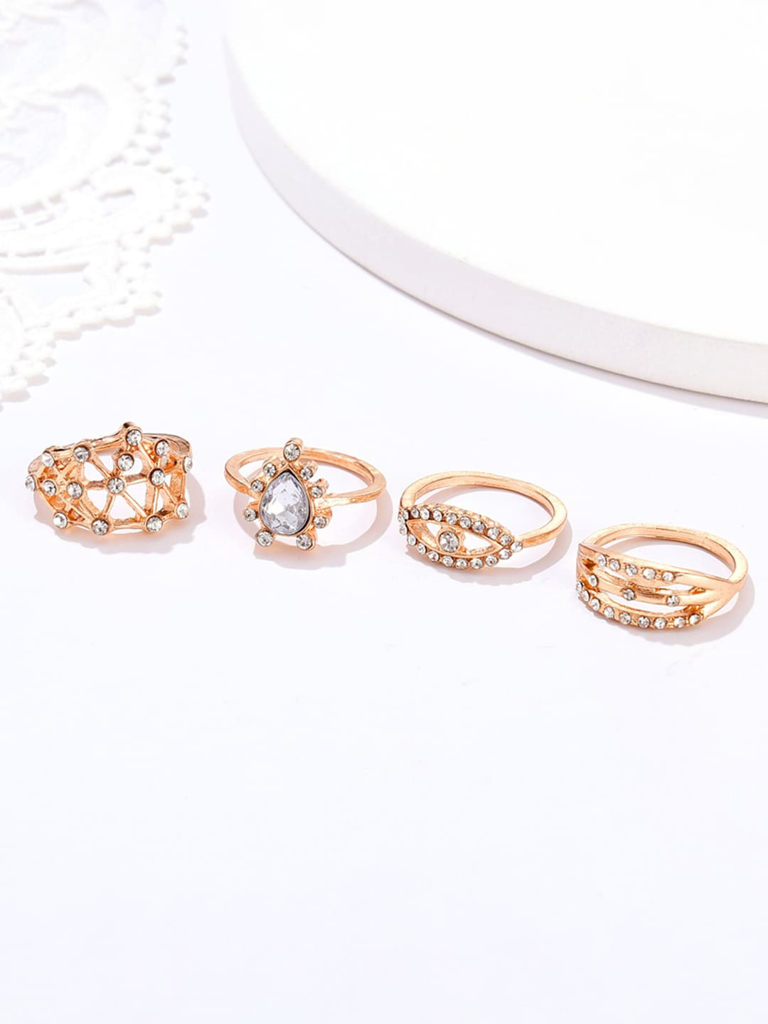 

URBANIC Women Set of 4 Gold-Toned Stone-Studded Finger Rings