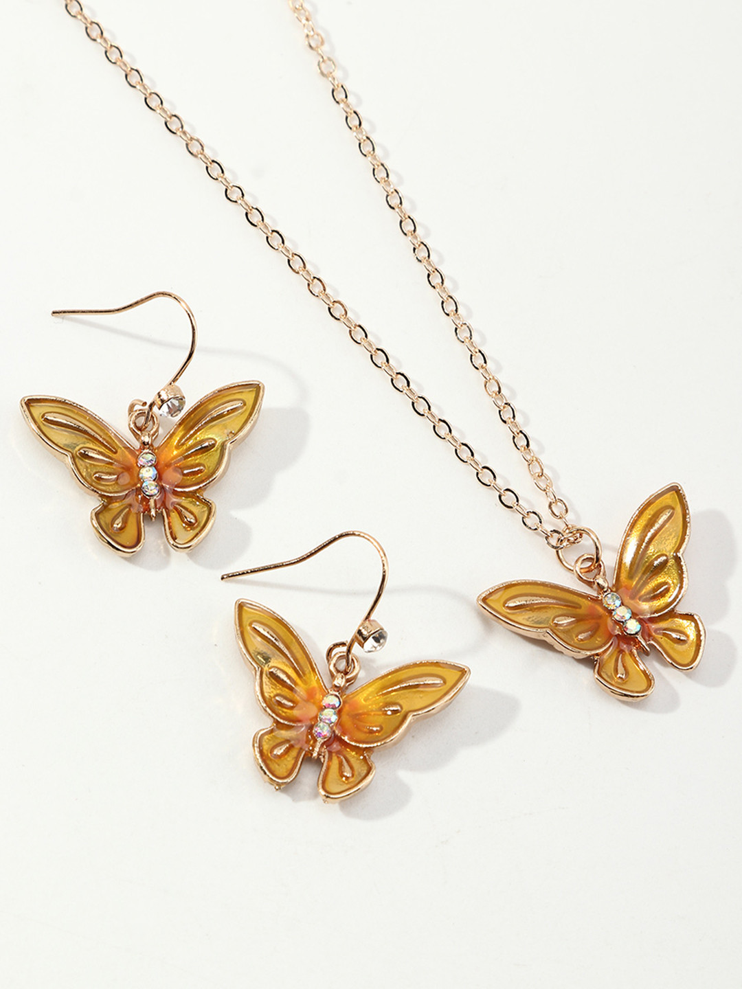 

URBANIC Gold-Toned Enamelled Butterfly Shaped Jewellery Set
