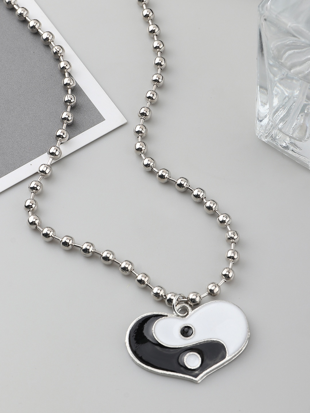 

URBANIC Silver-Toned & Black Yin Yang Enamelled Heart-Shaped Necklace