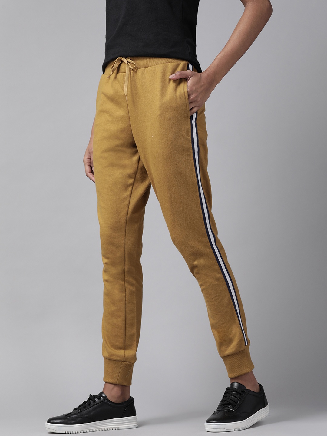 

Roadster Women Mustard Brown Solid Joggers with Side Taping