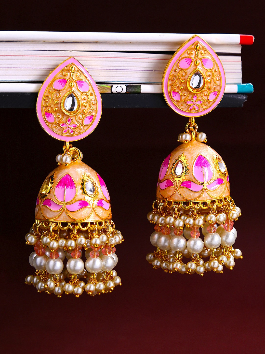 

Yellow Chimes Women Pink & Gold-Toned Dome Shaped Meenakari Jhumka Earrings