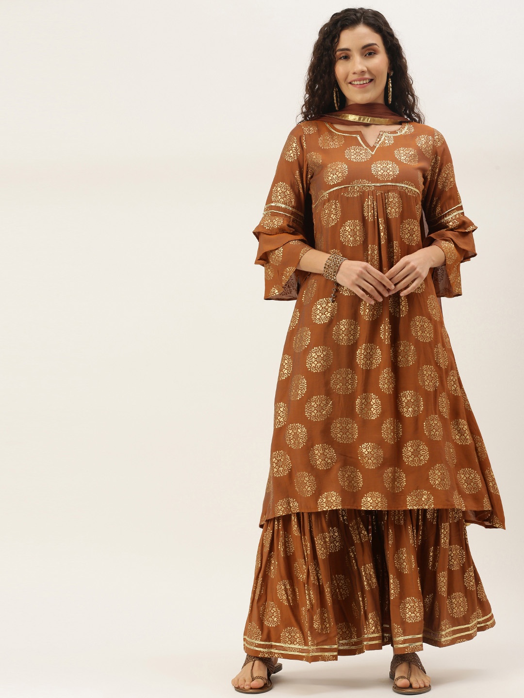 

VAABA Women Rust Brown & Golden Ethnic Motifs Foil Print Kurta with Sharara & Dupatta