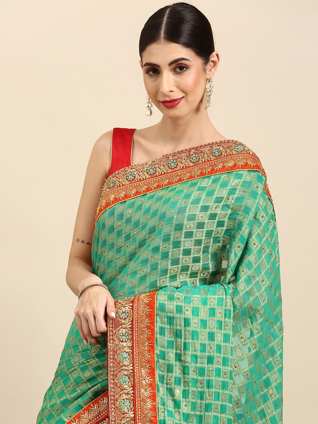 

Anouk Green & Orange Embellished Saree