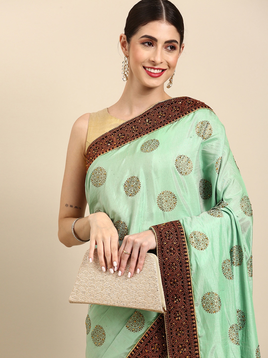 

Anouk Sea Green & Gold-Toned Embellished Saree