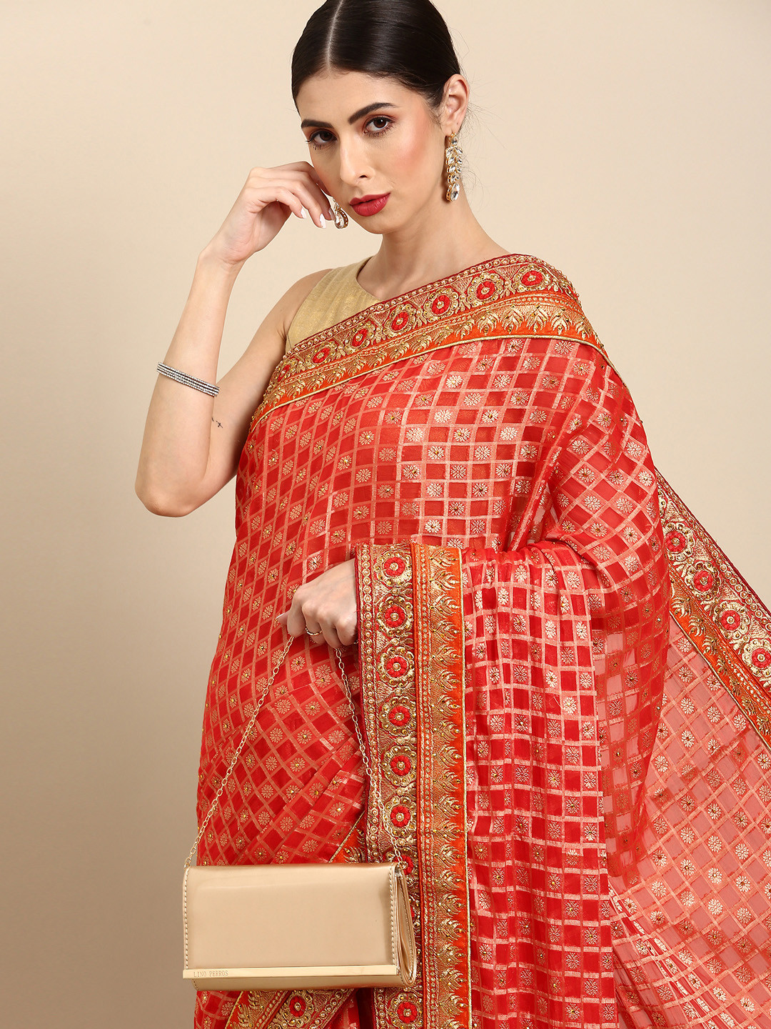 

Anouk Red & Golden Self-Checked Stone-Studded Detail Saree