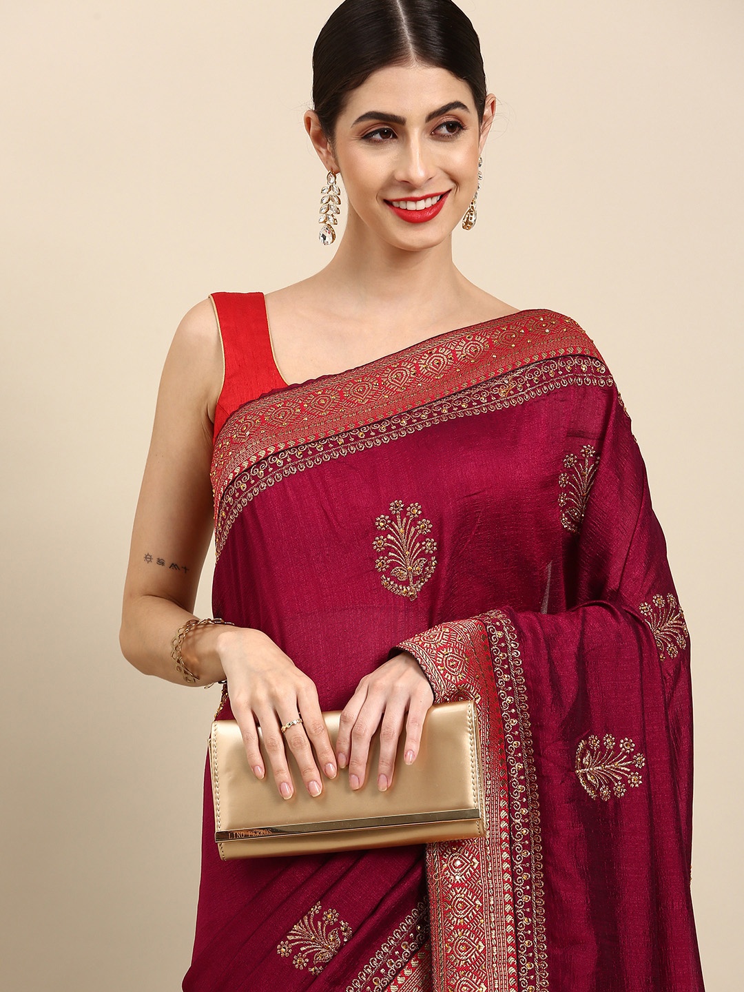 

Anouk Magenta & Red Embellished Beads and Stones Silk Blend Ready to Wear Kota Saree