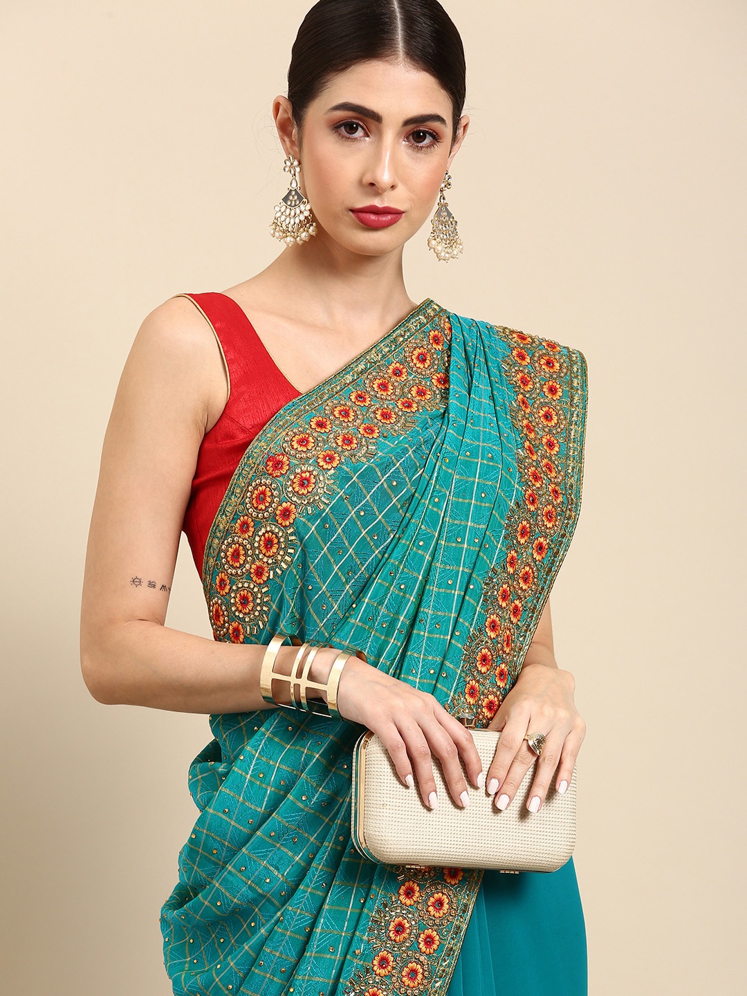 

Anouk Blue & Mustard Yellow Checked Beads and Stones Saree