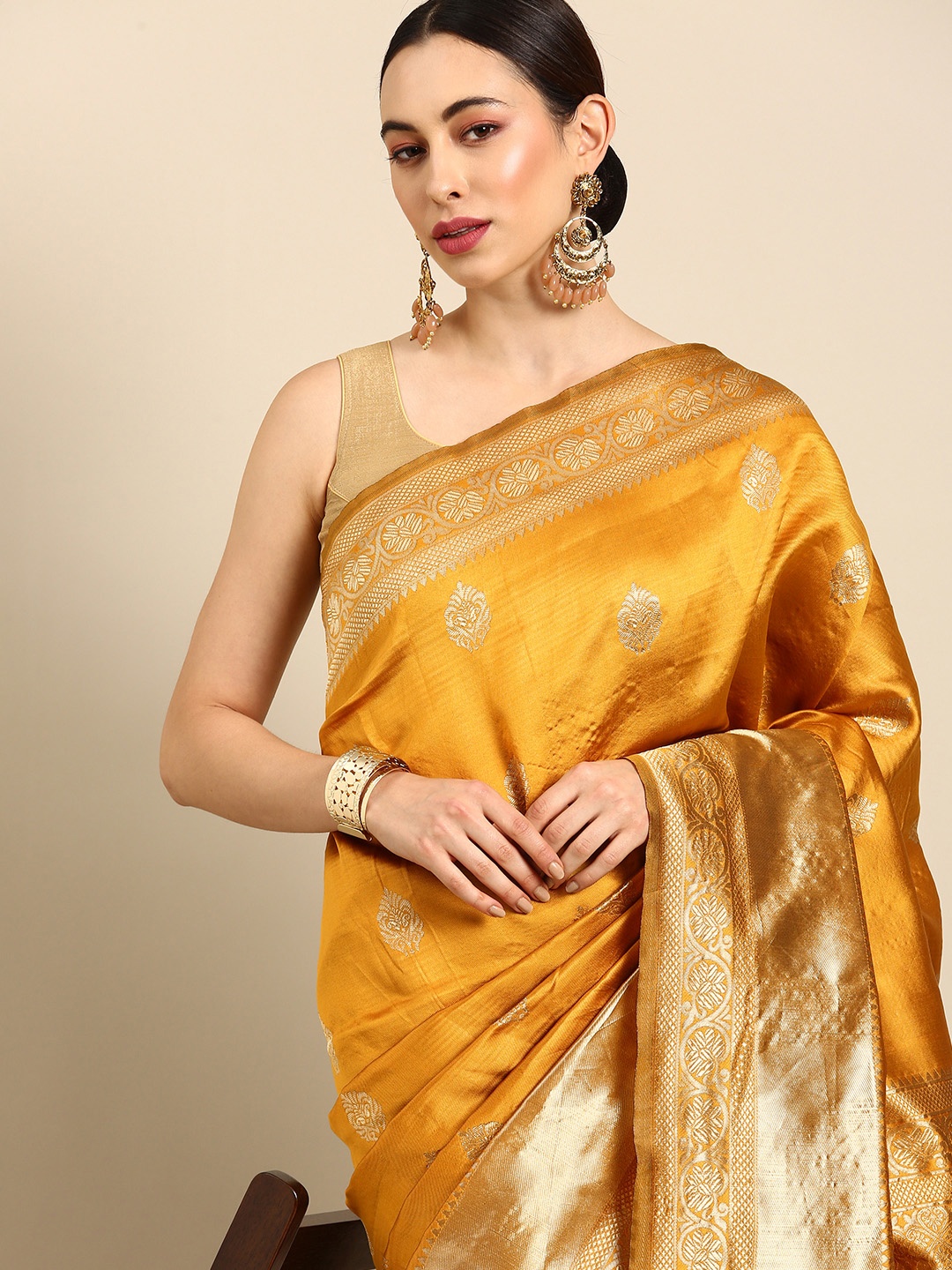 

Anouk Mustard Woven Design Zari Silk Blend Banarasi Saree