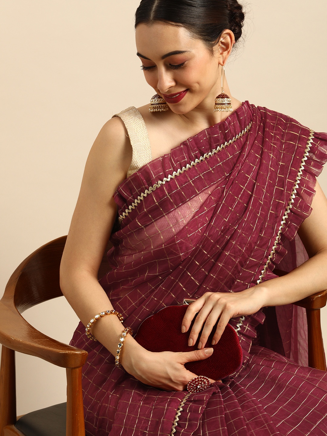 

Anouk Maroon & Golden Checked Ruffle Organza Chanderi Saree