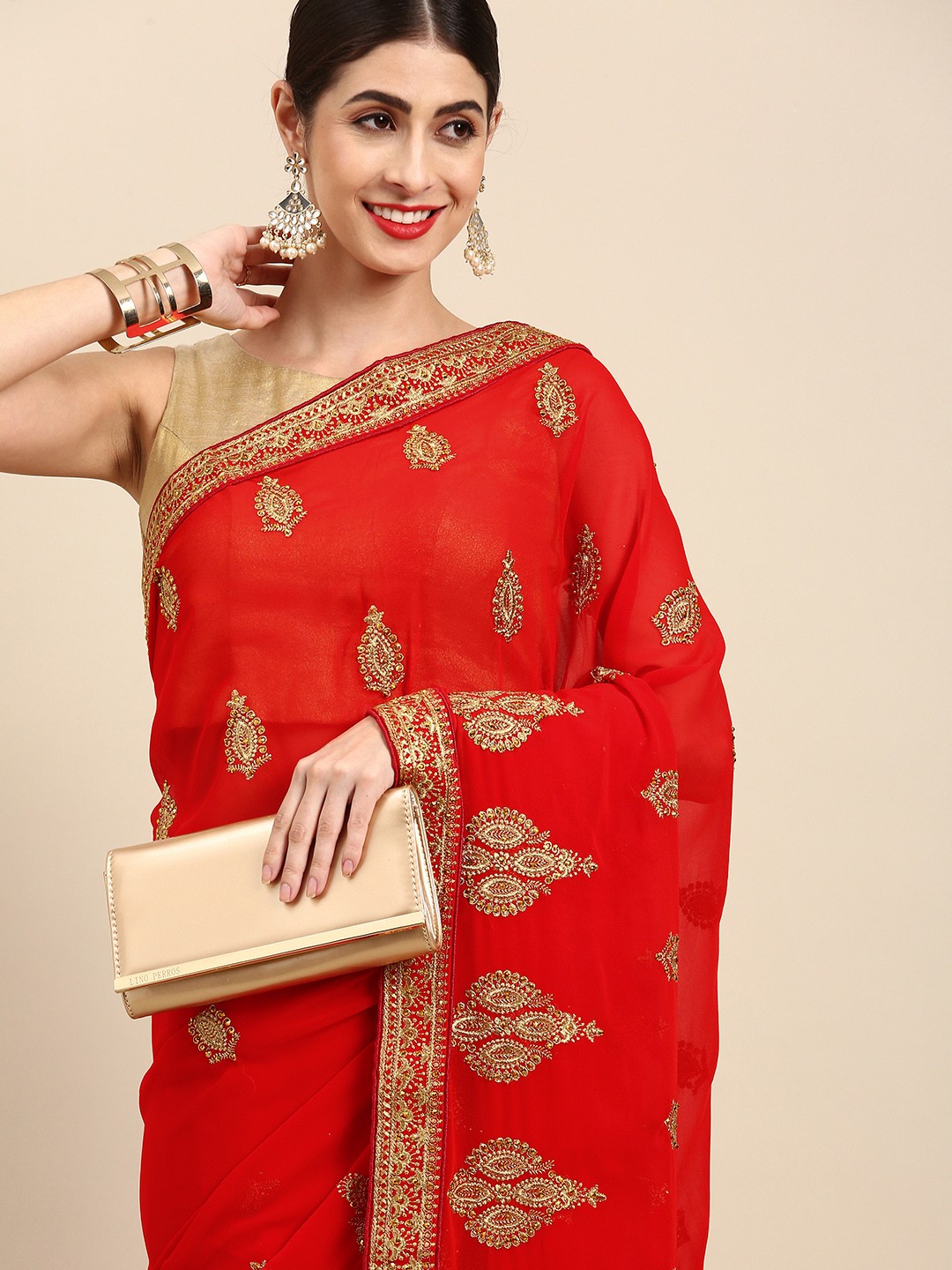 

Anouk Red & Golden Ethnic Motifs Embroidered Saree