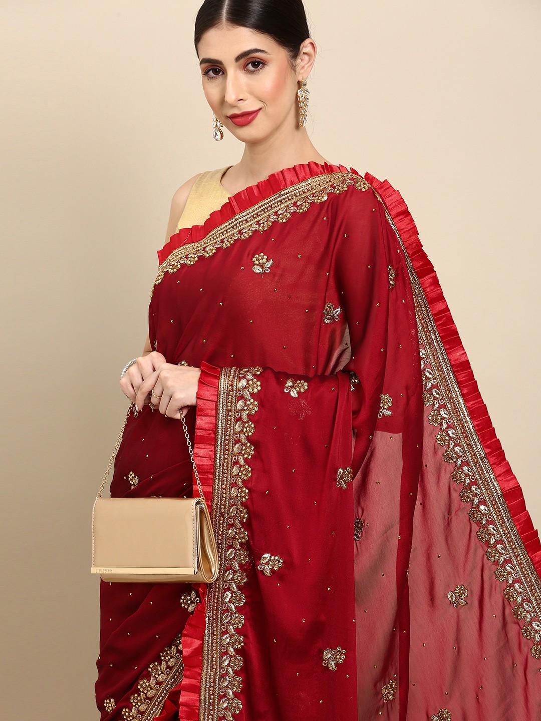 

Anouk Maroon & Golden Floral Embroidered Pleated Border Saree
