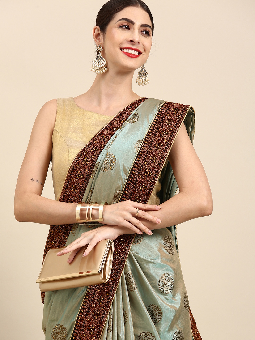 

Anouk Mint Green & Golden Ethnic Motifs Embroidered Pure Silk Saree