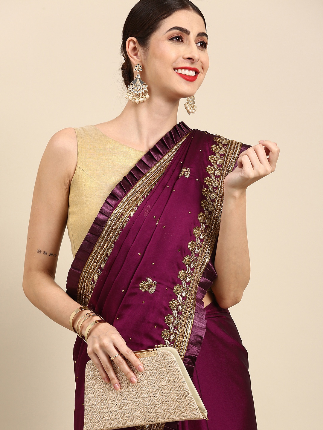 

Anouk Burgundy & Golden Embellished Tussar Saree