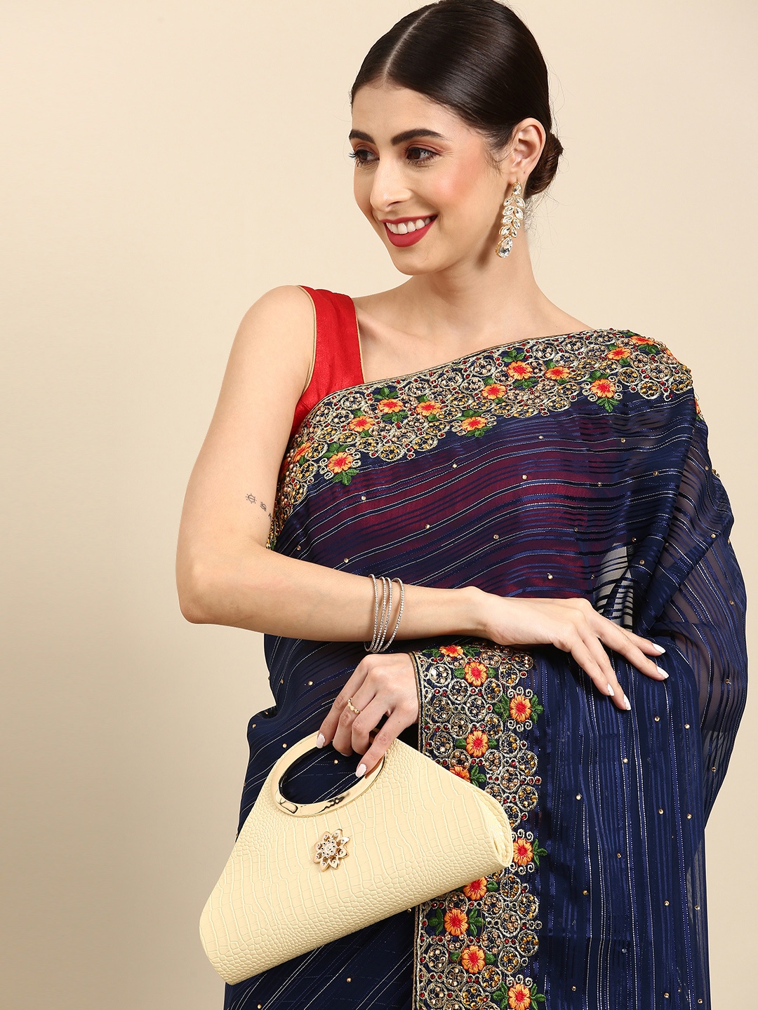 

Anouk Navy Blue & Golden Striped Saree with Embellished Detail