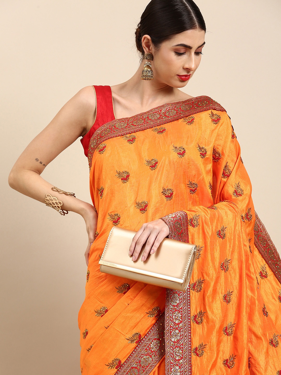 

Anouk Orange & Golden Ethnic Motifs Embroidered Pure Silk Saree