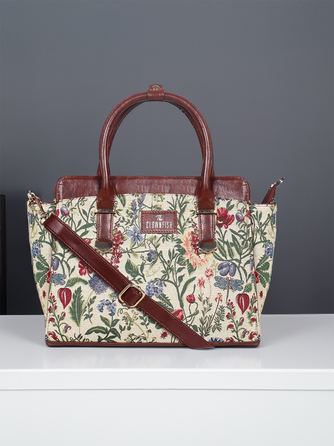 

THE CLOWNFISH Zella Beige Floral Printed Structured Handheld Bag with Tasselled