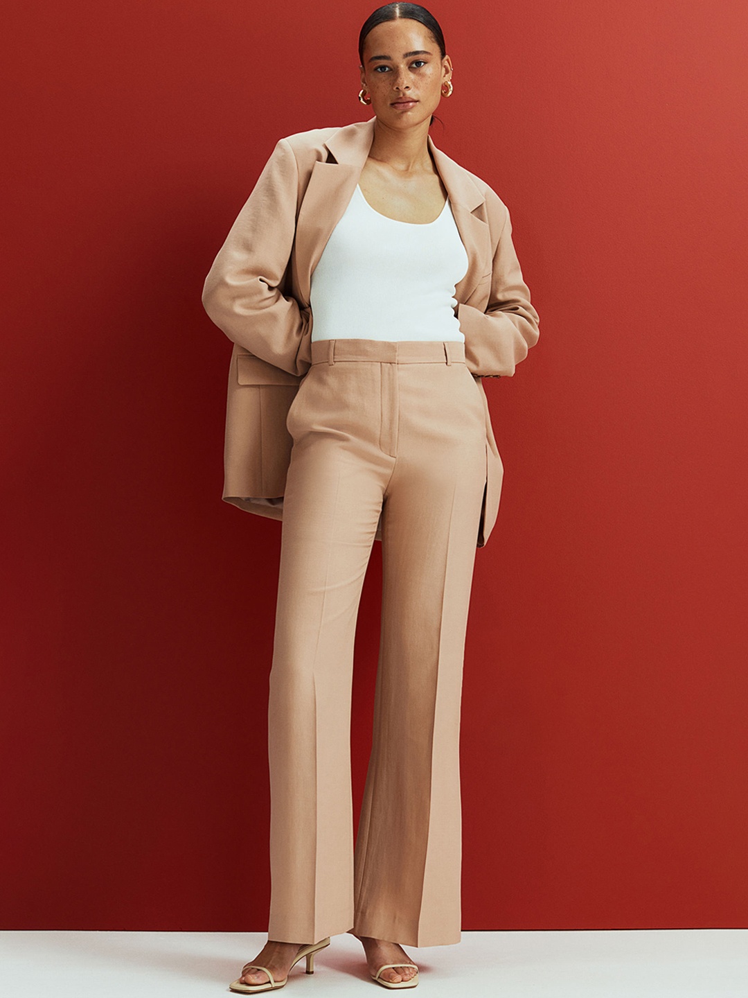 

H&M Woman Beige Flared lyocell-blend trousers