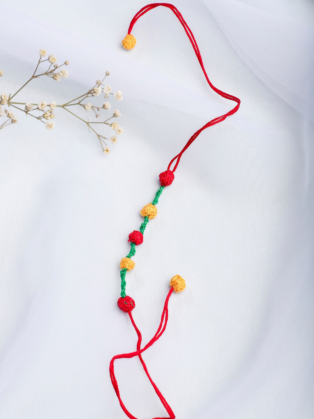 

Fabindia Multicoloured Thread Tie-Up Rakhi, Multi