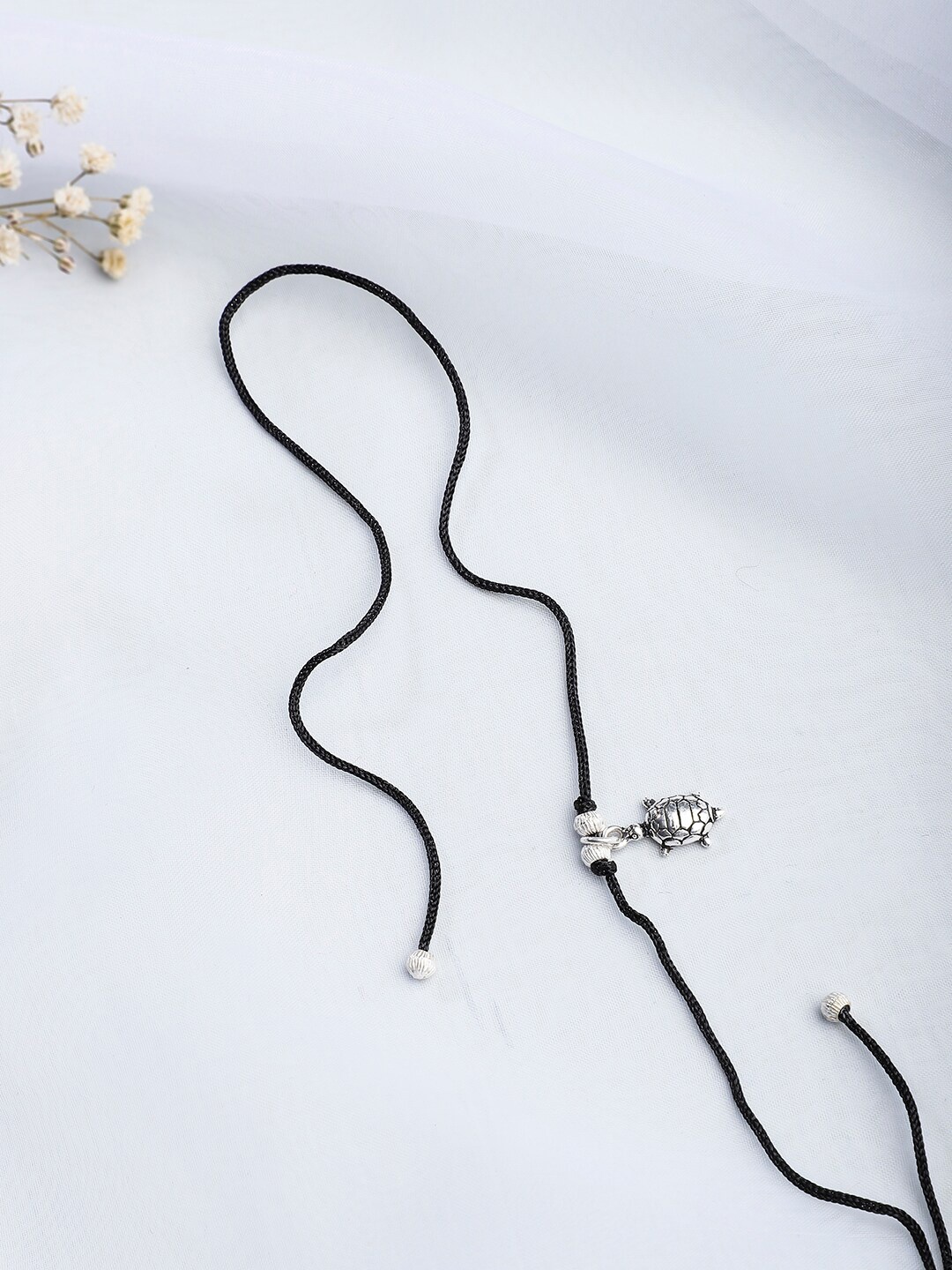 

Fabindia Black & Silver Tie-Up Rakhi
