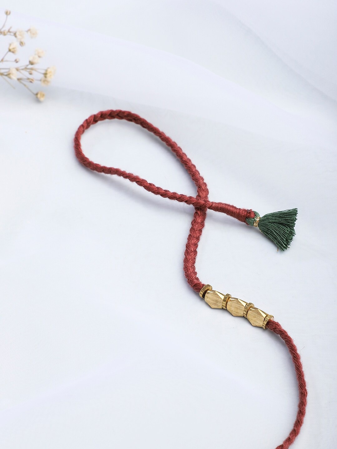 

Fabindia Maroon Thread Embellished Rakhi