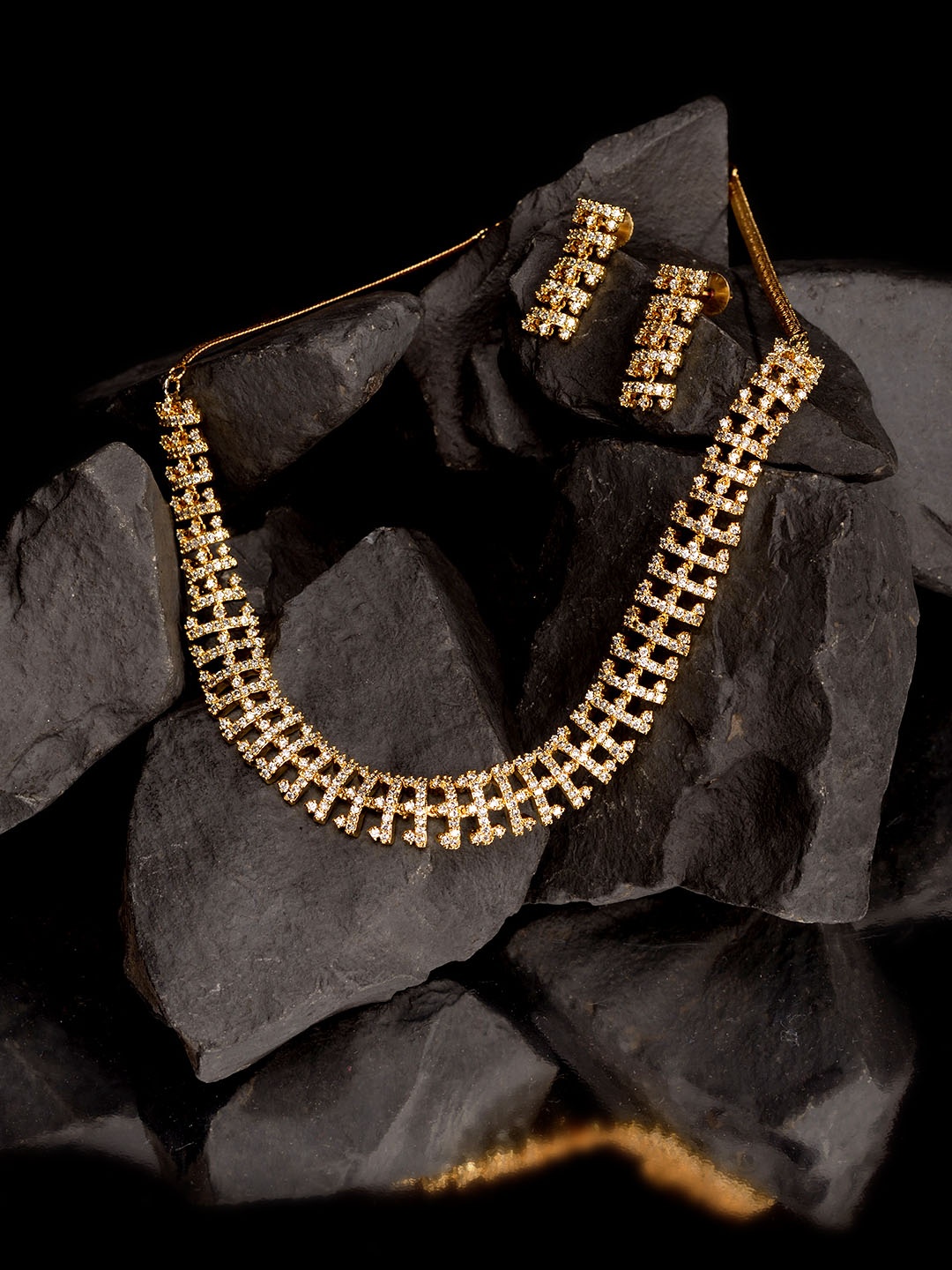 

Saraf RS Jewellery Women Gold-Plated & White AD-Studded Handcrafted Jewellery Set