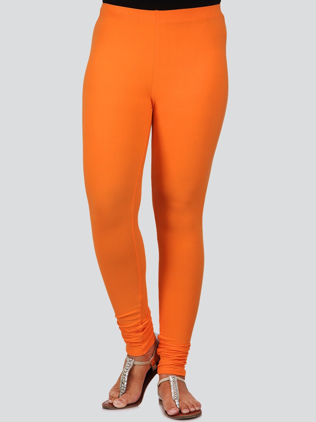 

PinkLoom Women Orange Solid Churidar-Length Leggings