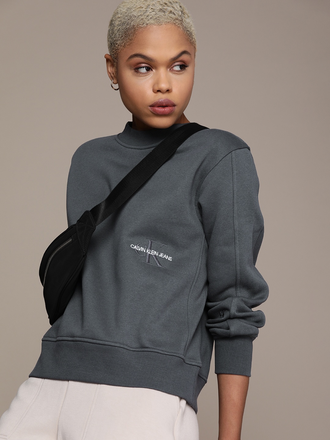 

Calvin Klein Jeans Women Grey Solid Crew Neck Sweatshirt