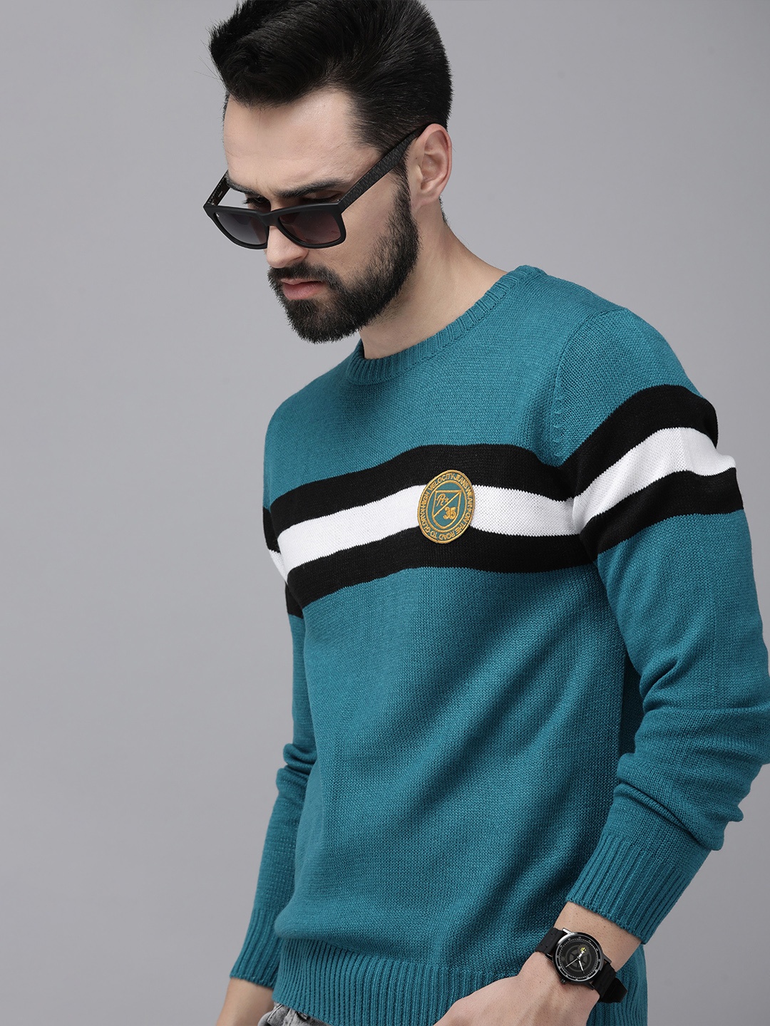 

Roadster Men Teal Blue & Black Colourblocked Acrylic Pullover with Applique Detail