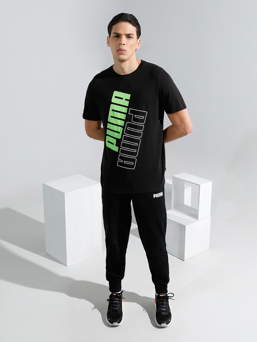 

Puma Men Black & Fluorescent Green Regular Fit POWER Brand Logo Printed T-shirt