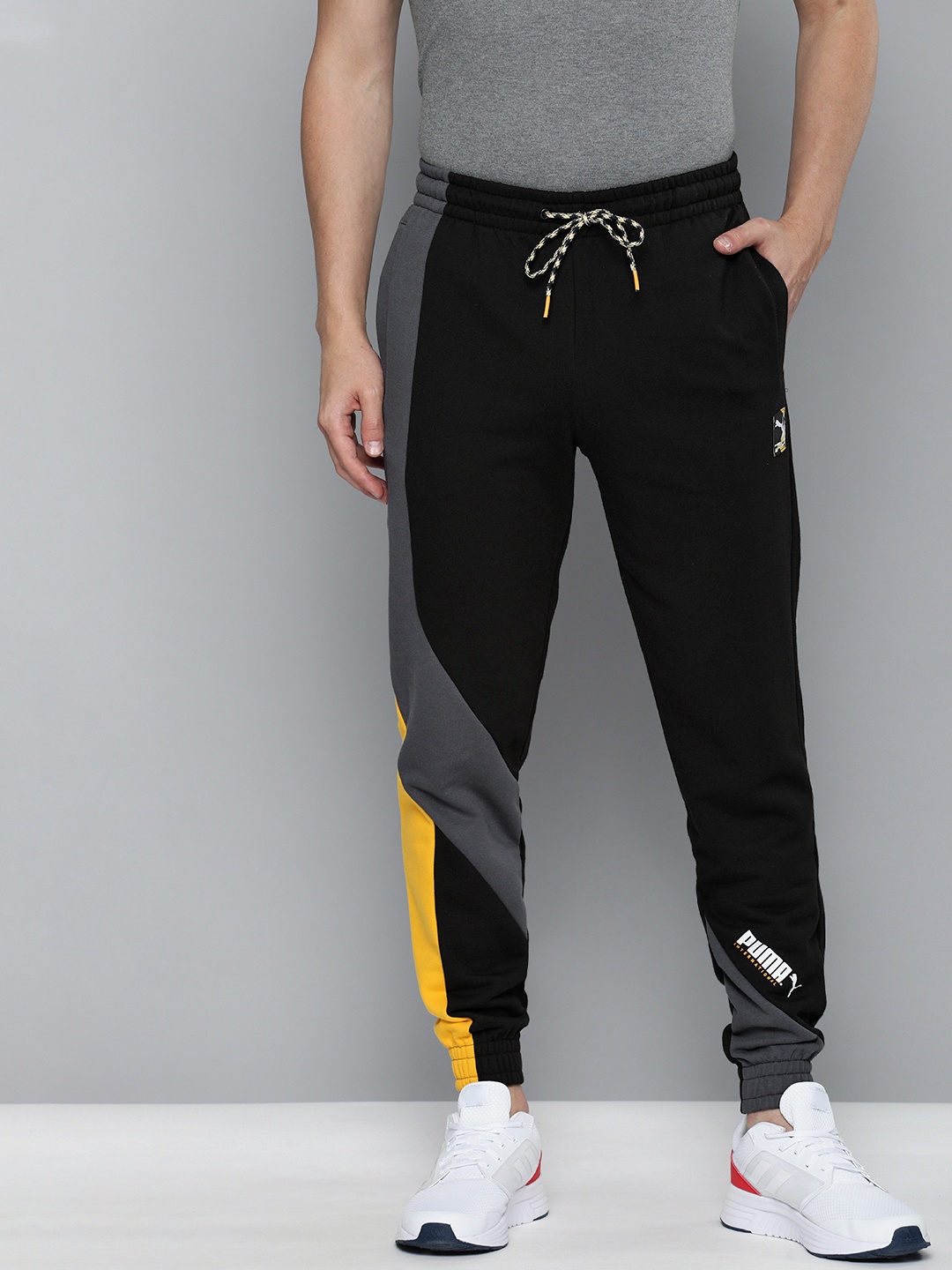 

Puma Men Black & Charcoal Grey Colourblocked International Knitted Joggers