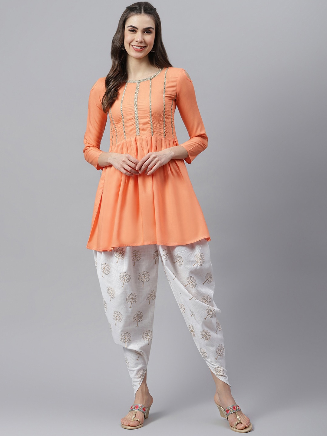 

Stylum Women Peach-Coloured Yoke Design Pleated Thread Work Kurta with Dhoti Pants