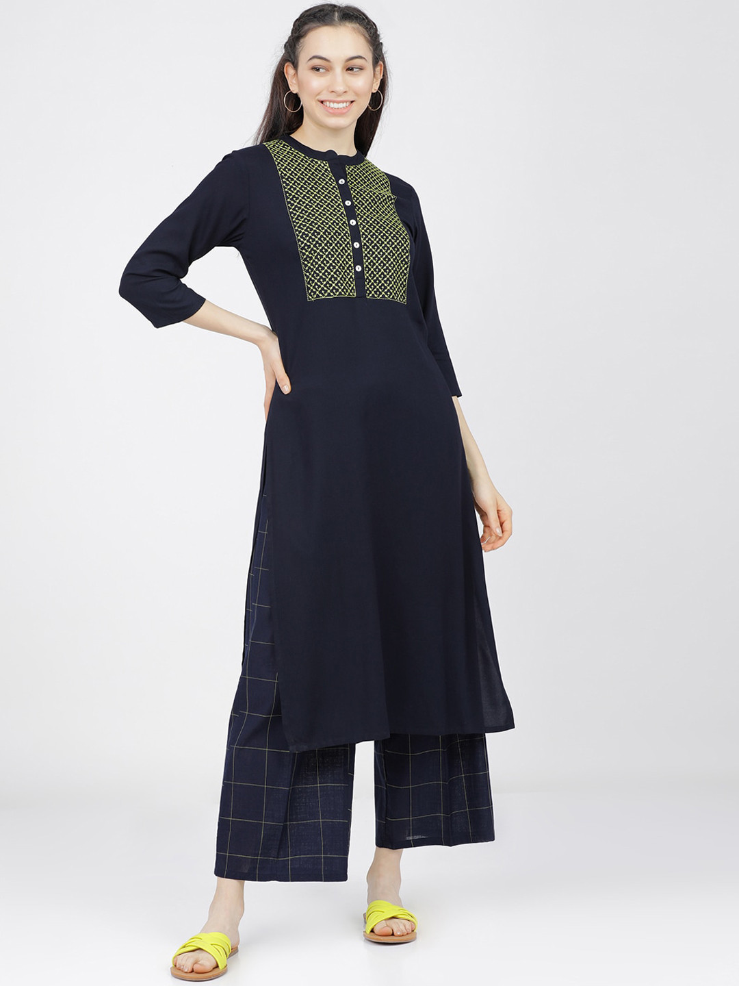 

Vishudh Women Navy Blue Floral Yoke Design Thread Work Kurta