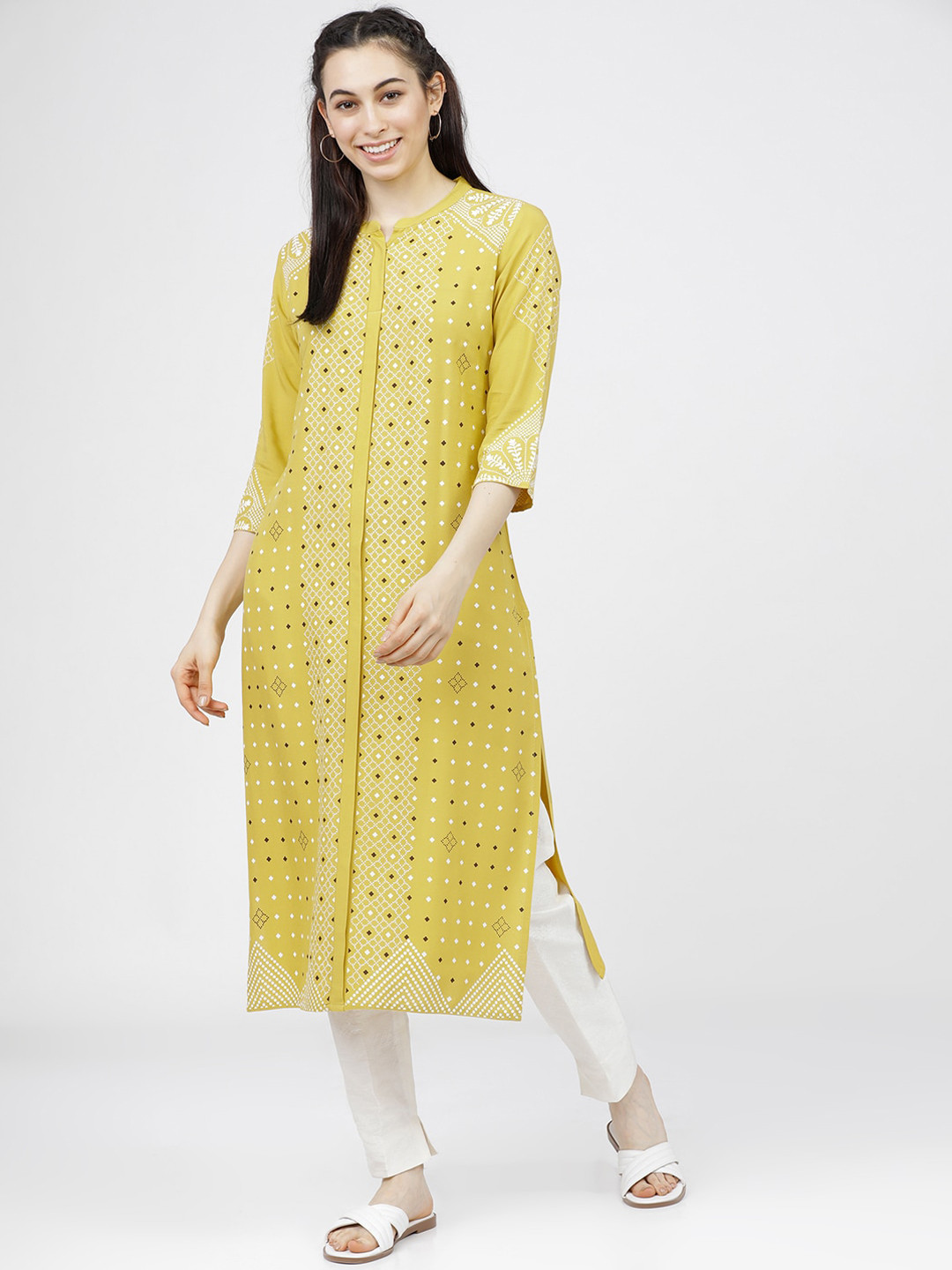 

Vishudh Women Yellow & White Geometric Screen Printed Straight Kurta