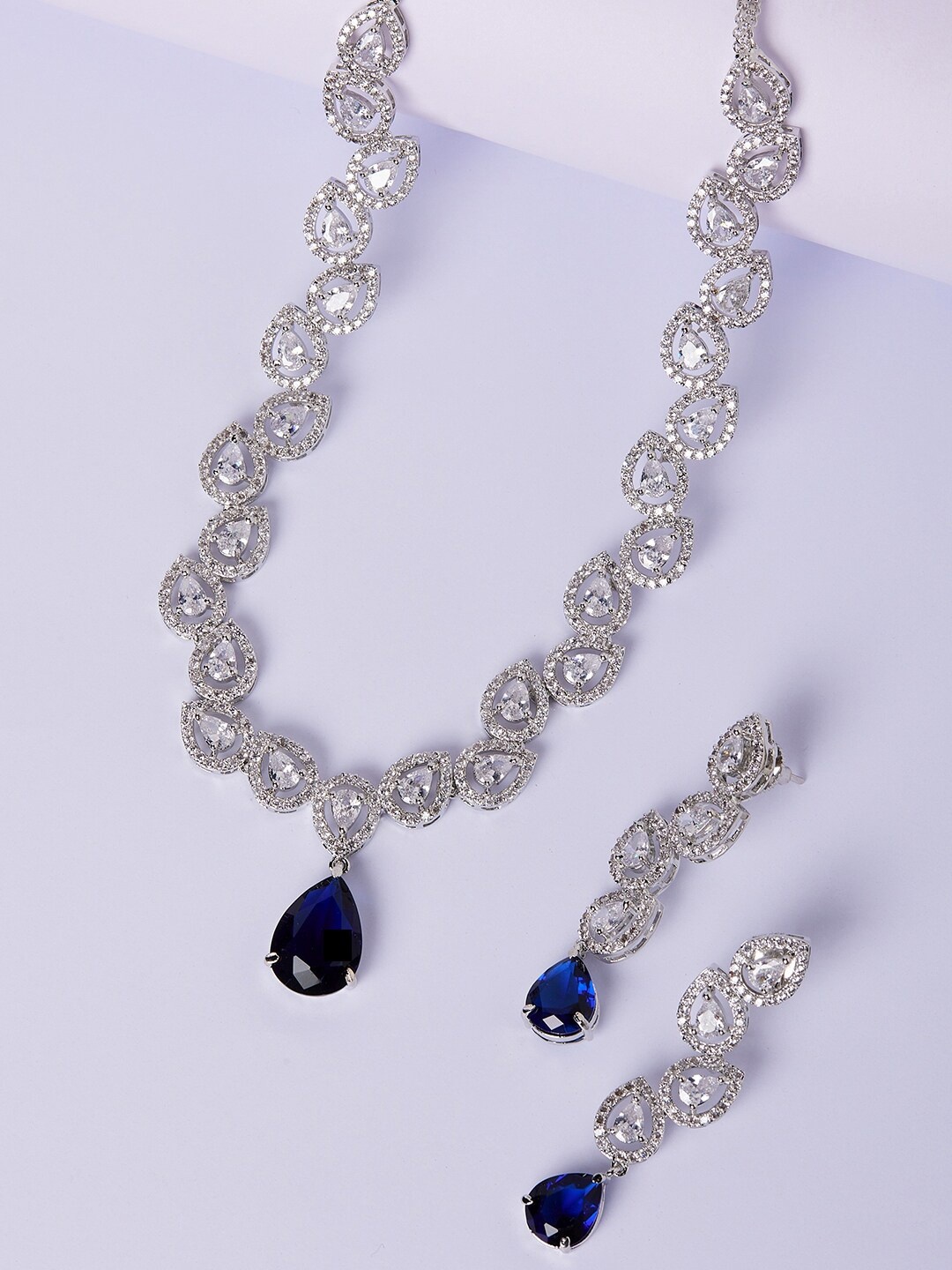 

GloBox By ZeroKaata Rhodium-Plating Silver-Toned & Blue AD-Studded Handcrafted Jewellery Set