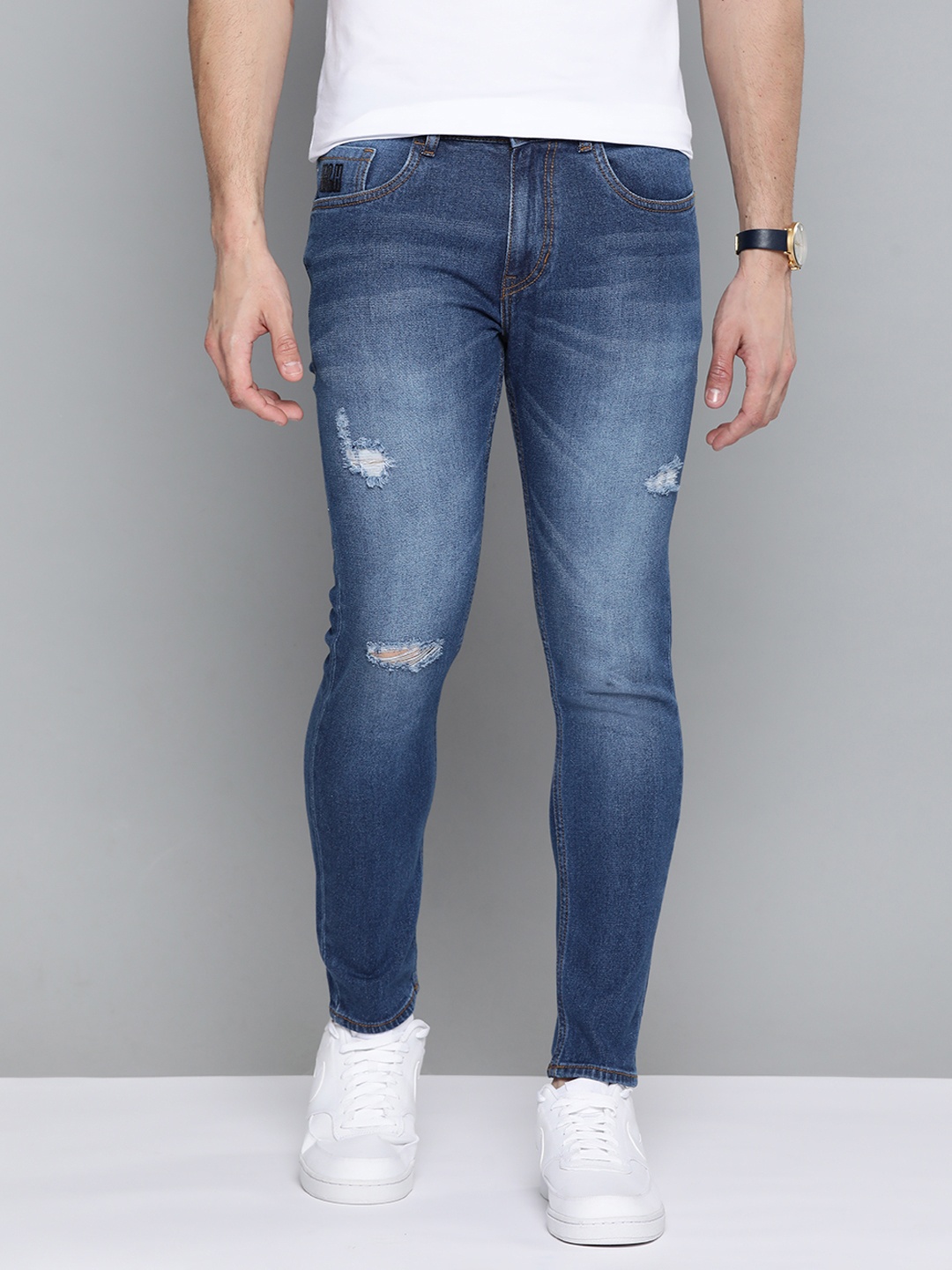 

Mast & Harbour Men Blue Skinny Fit Low Distress Light Fade Stretchable Jeans
