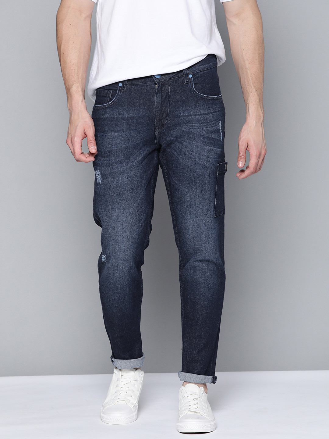 

Mast & Harbour Men Carrot Fit Mildly Distressed Light Fade Stretchable Jeans, Na