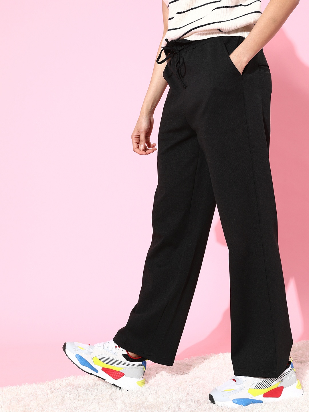 

Moda Rapido Women Stylish Black Solid Kick Flared Trousers