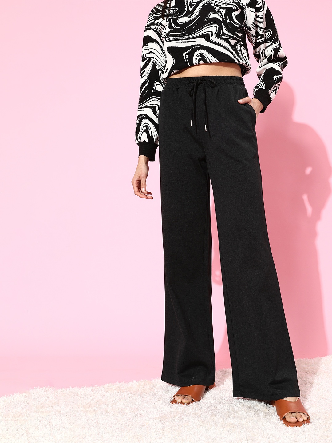 

Moda Rapido Women Stylish Black Solid Kick Flared Trousers