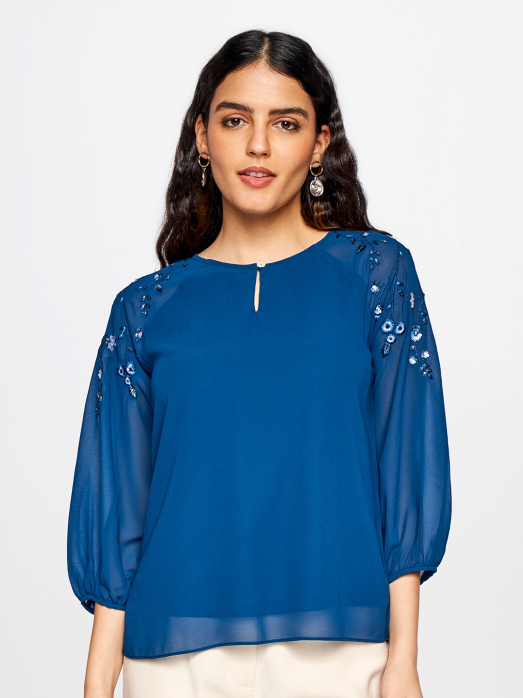 

AND Blue Floral Embellished Keyhole Neck Studded Blouson Top