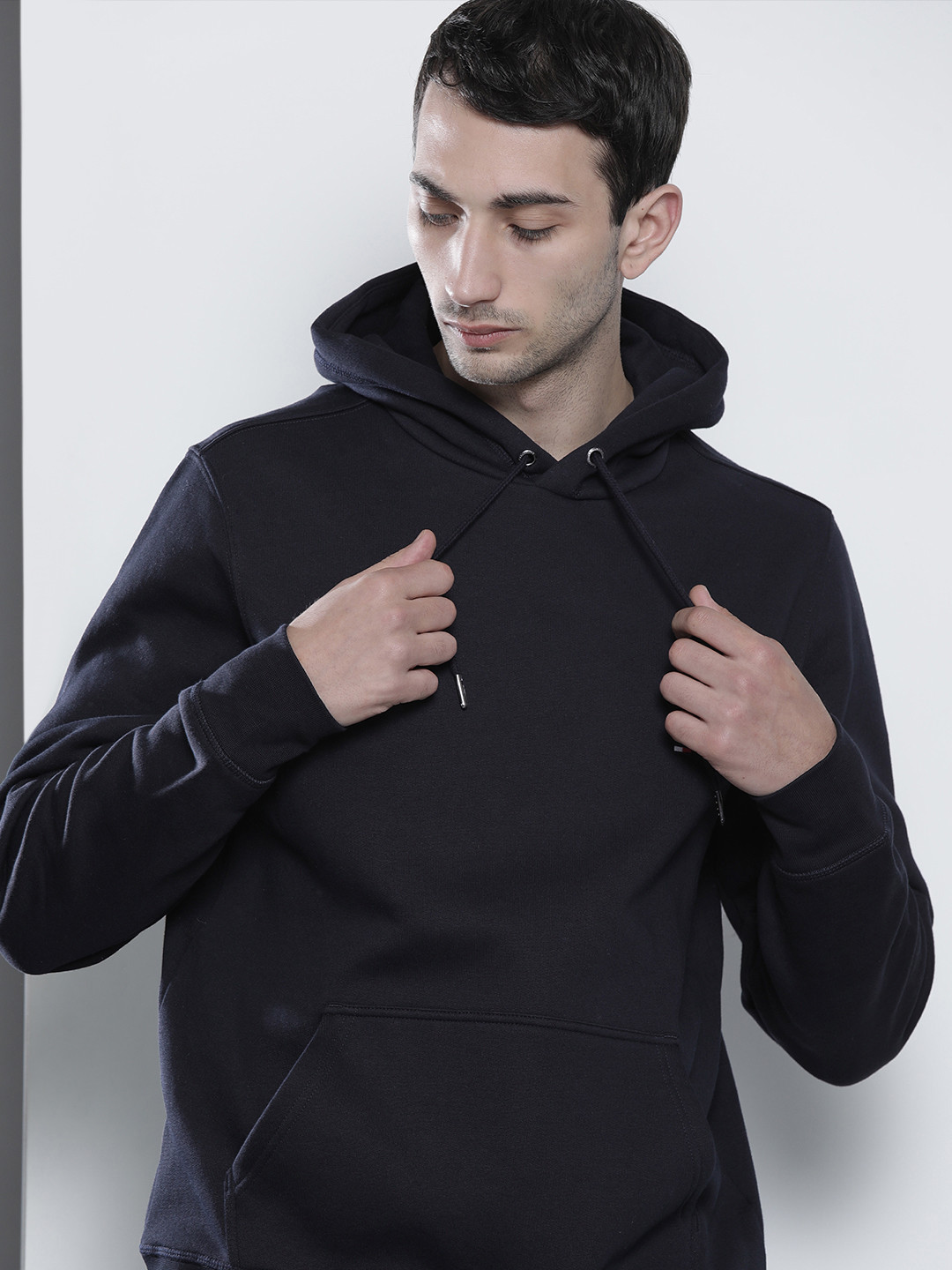 

Tommy Hilfiger Men Navy Blue Hooded Sweatshirt