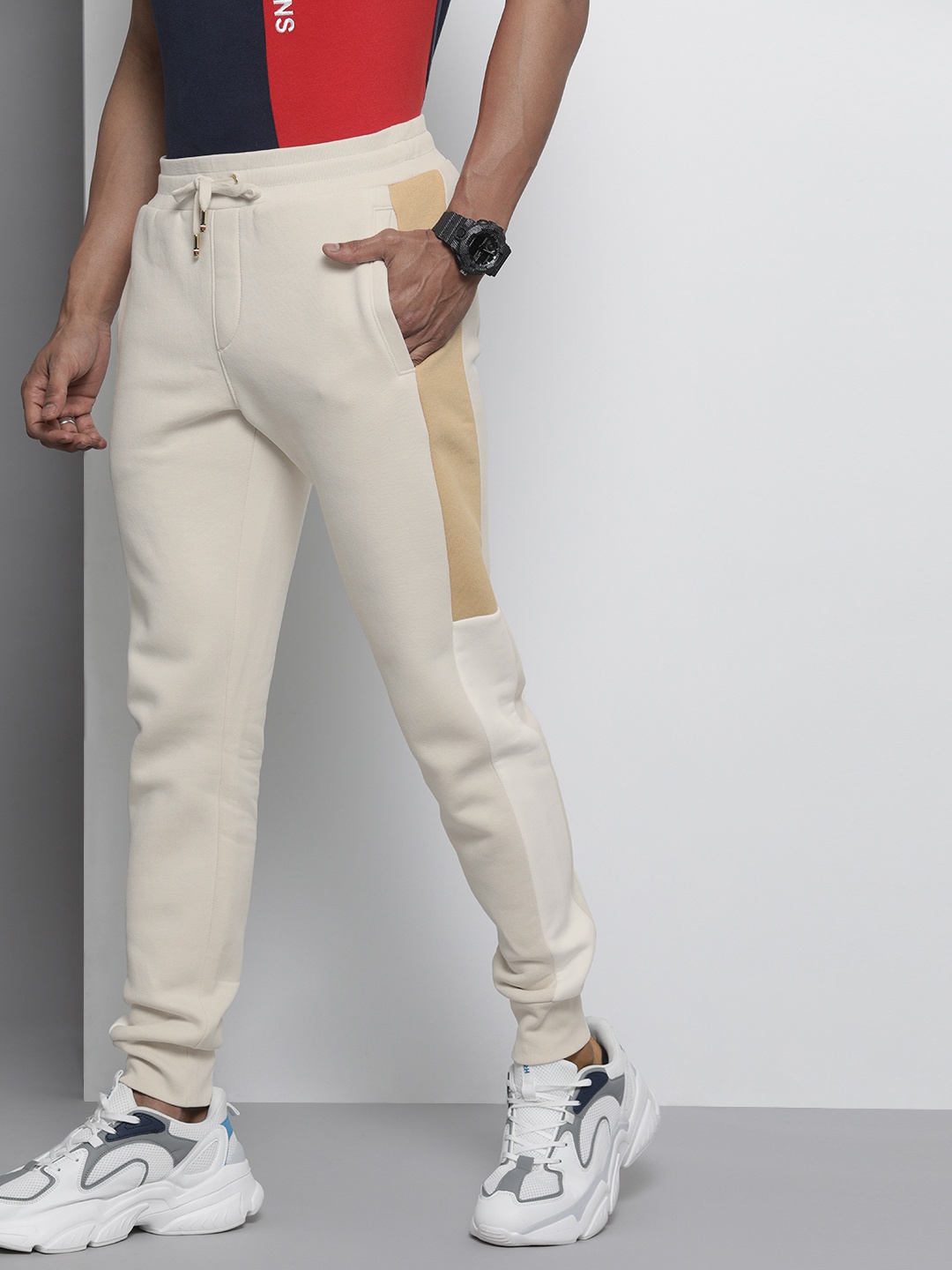 

Tommy Hilfiger Men Beige Solid Straight Fit Joggers with Colourblocked Detail