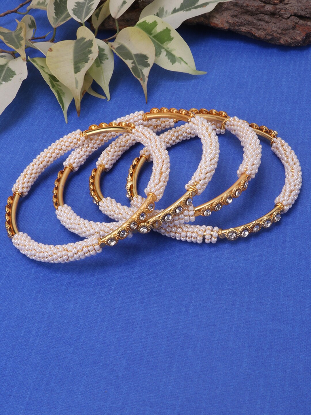 

JEWELS GEHNA Set of 4 Gold Plated & White Pearl and Stone Studded Handcrafted Bangles`