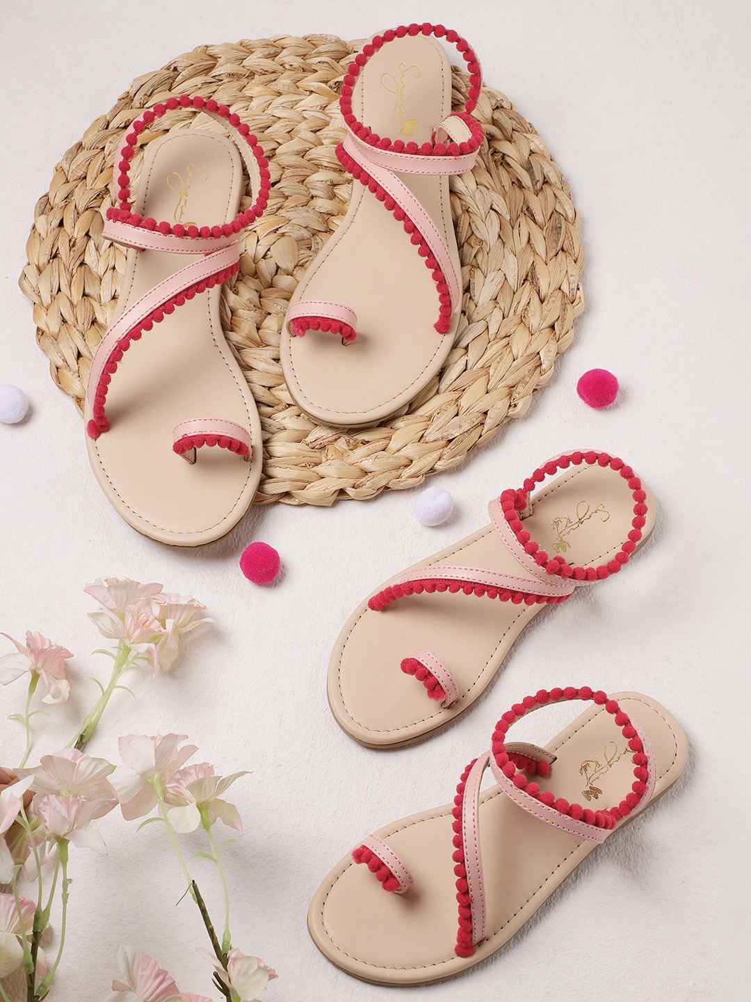 

Sangria Girls Pink Solid One Toe Flats with Pom Pom Detail