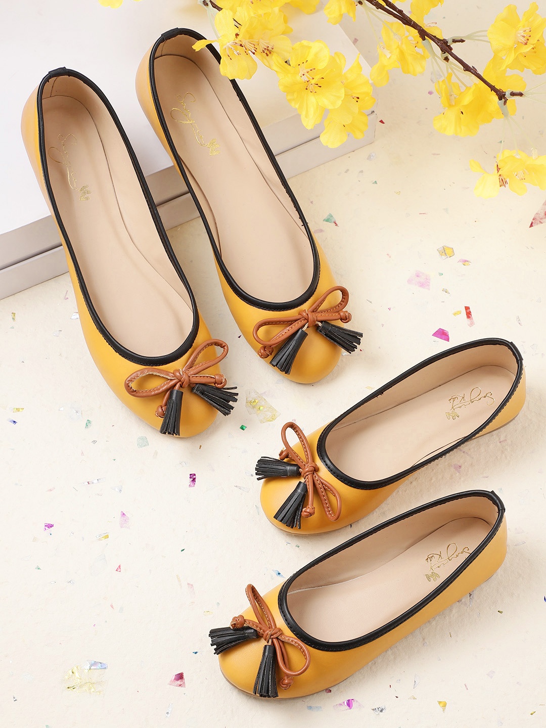 

Sangria Girls Mustard Yellow & Brown Solid Ballerinas with Bow & Tasselled Detail